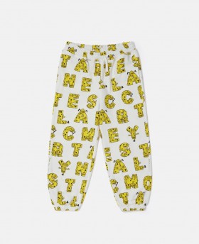  Spodnie dresowe Stella Mccartney Spongebob Graphic w kolorze kremowo-żółtym | Spodnie i szorty dziecięce