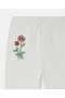 Stella McCartney Pantaloni de trening cu șnur Woodland Friends, albi | Pantaloni și pantaloni scurți pentru copii